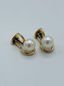 Pair of 9k gold pearl clip-on earrings.