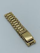 9ct gold watch strap by Britton & Sons.