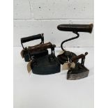 Three assorted metal hand irons and a goffering iron.