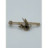 Yellow metal brooch set with a sapphire, diamond and seed pearl 'fly'.