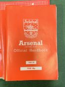 10 Arsenal Football Club handbooks.