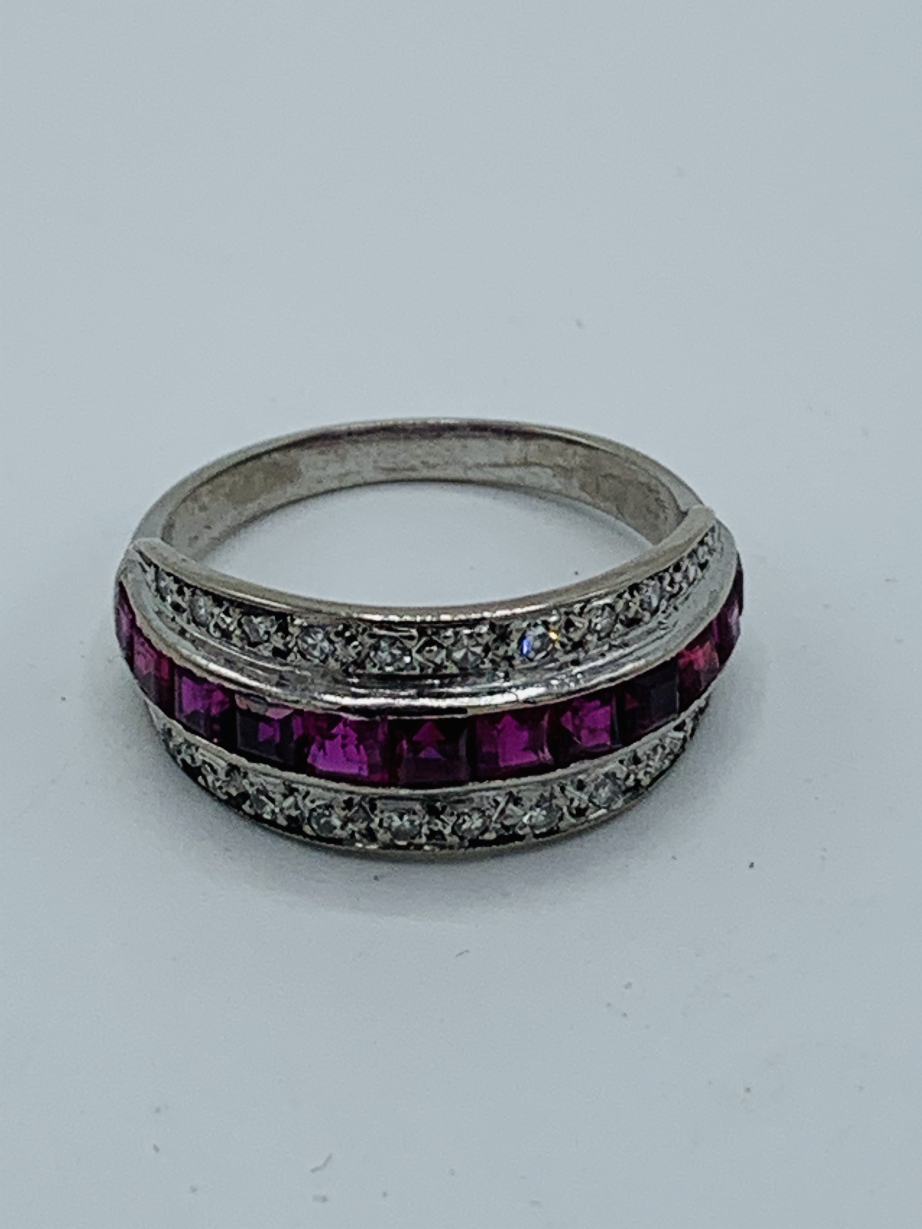 18ct white gold Art Deco diamond and ruby half eternity ring. Size O. Weight 4.6 gms