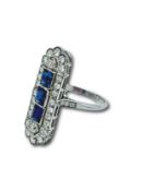 Sapphire and diamond long finger ring.