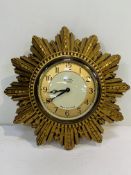 1930’s Smiths electric Sunburst clock. Gold chapter ring, domed glass