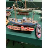 Three model boats.