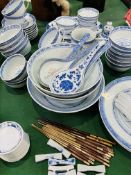 A quantity of blue and white Chinese dinnerware.