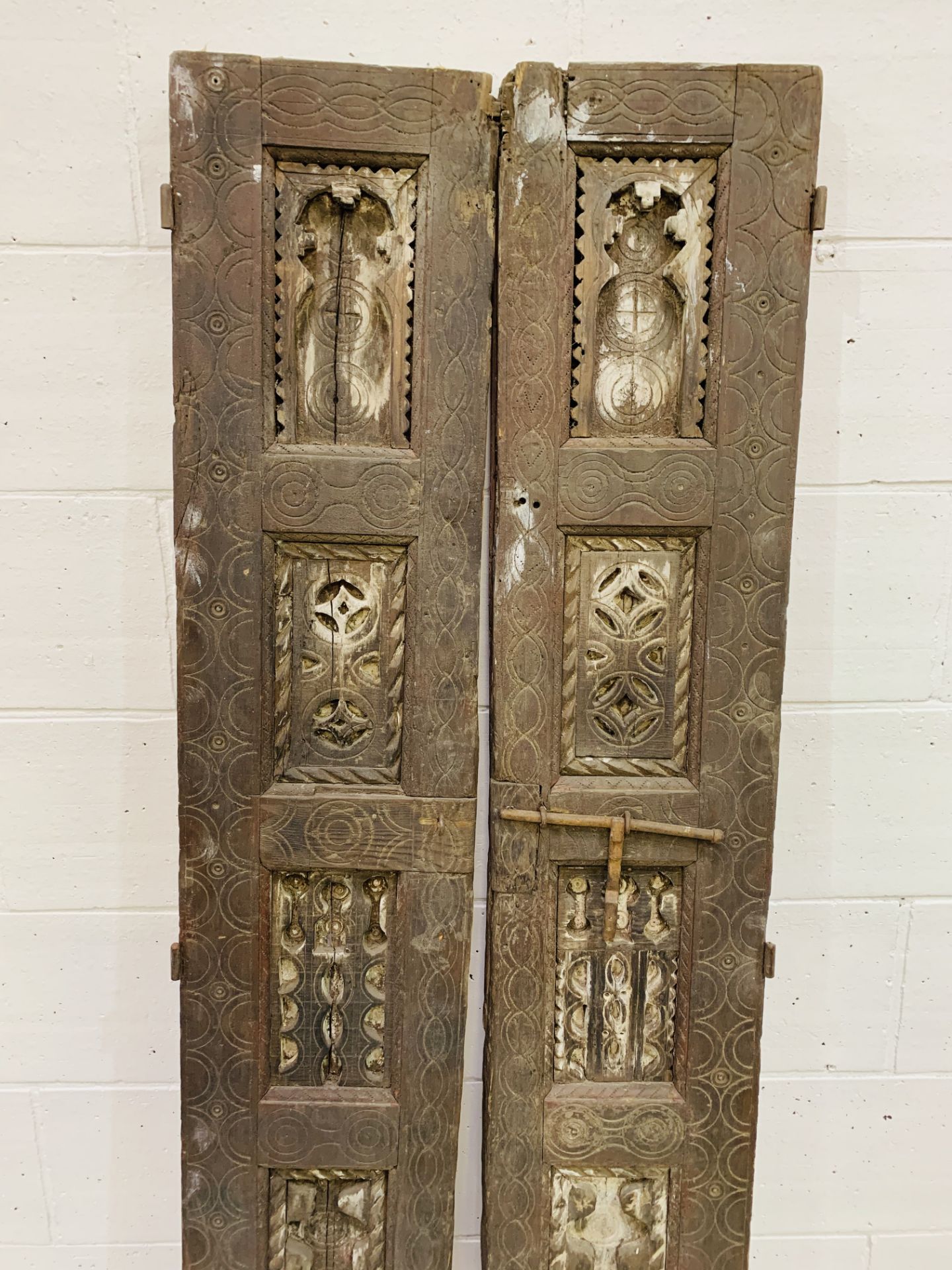 A pair of decorative carved antique wooden shutters, each measuring 33 x 5 x 199cms. - Image 2 of 3