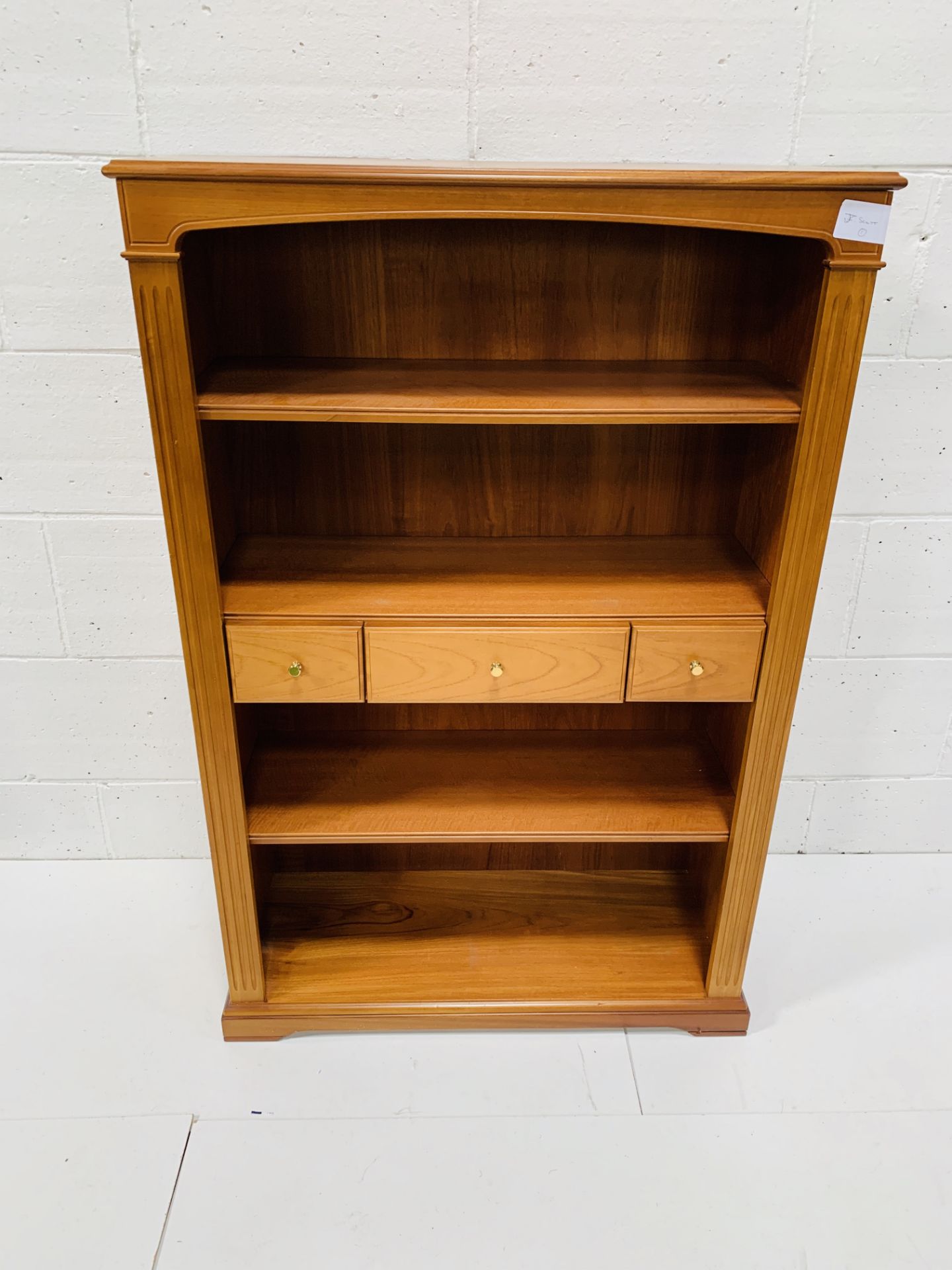 Mahogany open bookcase by Legate.