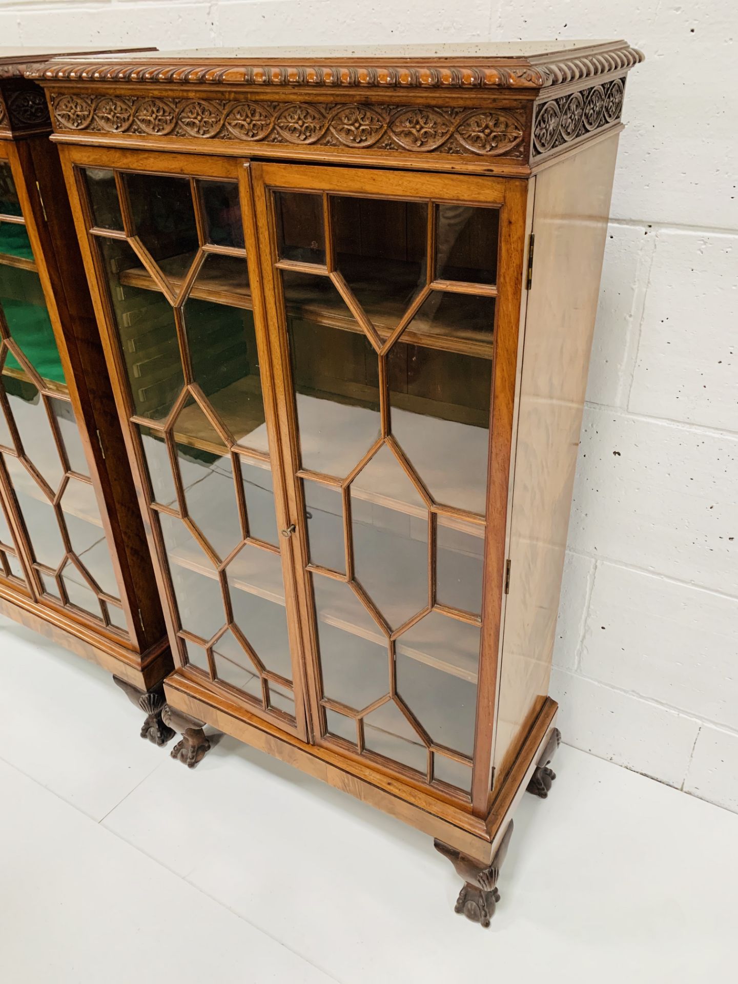 A pair of flame mahogany glass fronted small bookcases. - Image 2 of 3