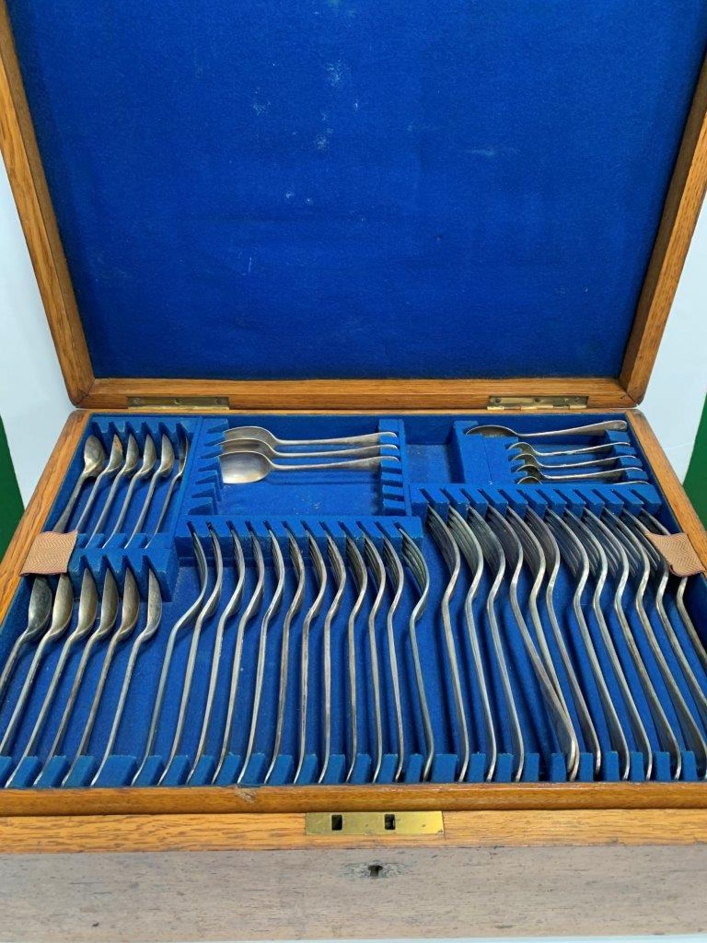 A brass bound oak cased part canteen of silver plated cutlery, by Harrison Fisher and Co.