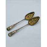 2 George III silver and silver-gilt berry spoons.