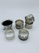 Pair of silver napkin rings, oriental silver napkin ring and three other silver pieces.