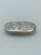 Continental silver lozenge shaped antique snuff box with decorated repousse