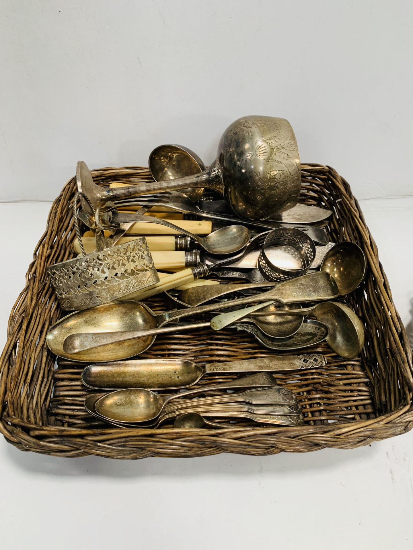 Silver spoons; a quantity of silver plated cutlery; and a silver plated butter dish.