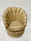 Upholstered shell shape armchair.