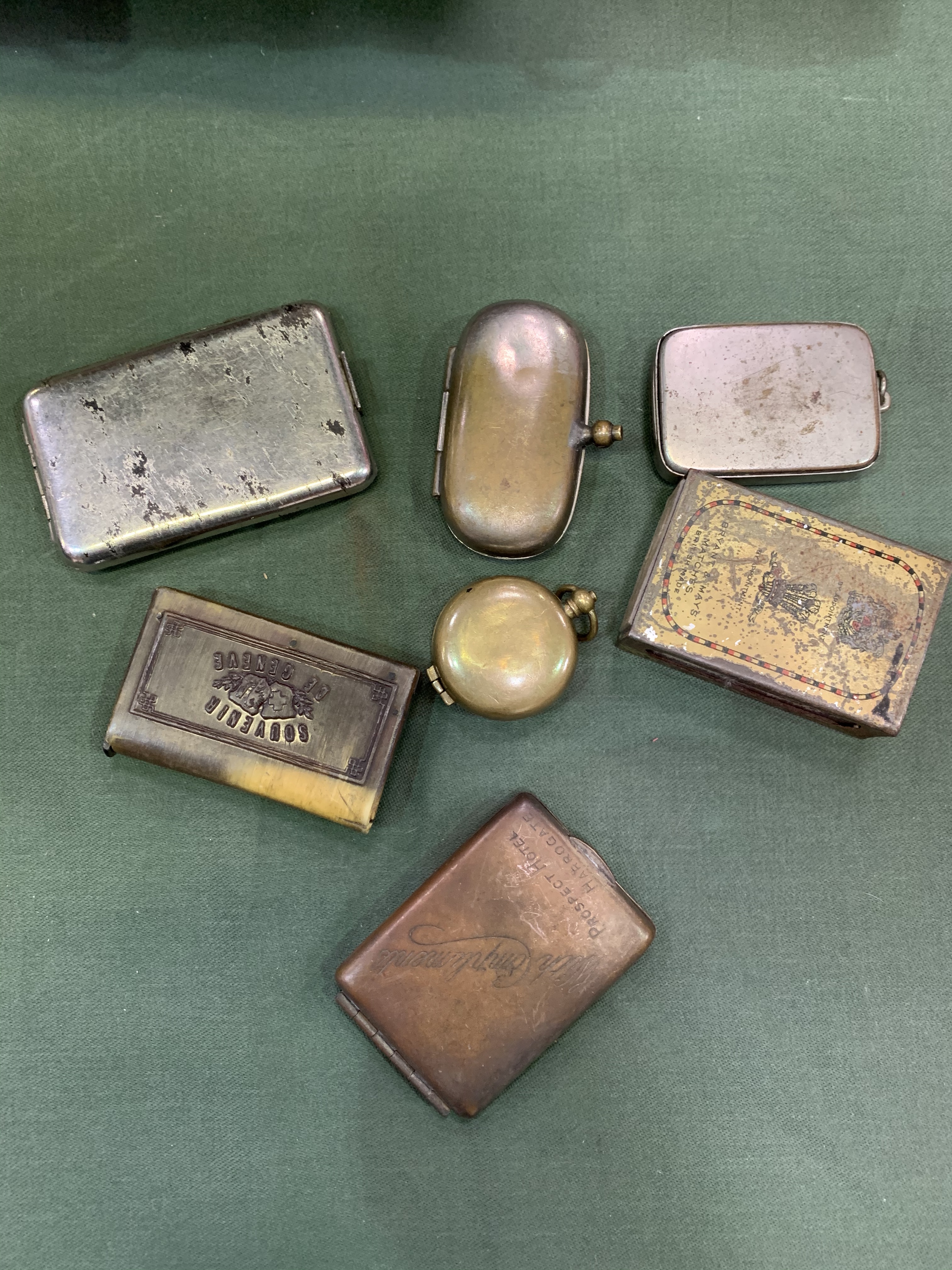 Two sovereign holders and five vintage smoking accessories.