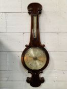 Flame mahogany case of banjo form barometer and thermometer by James How.