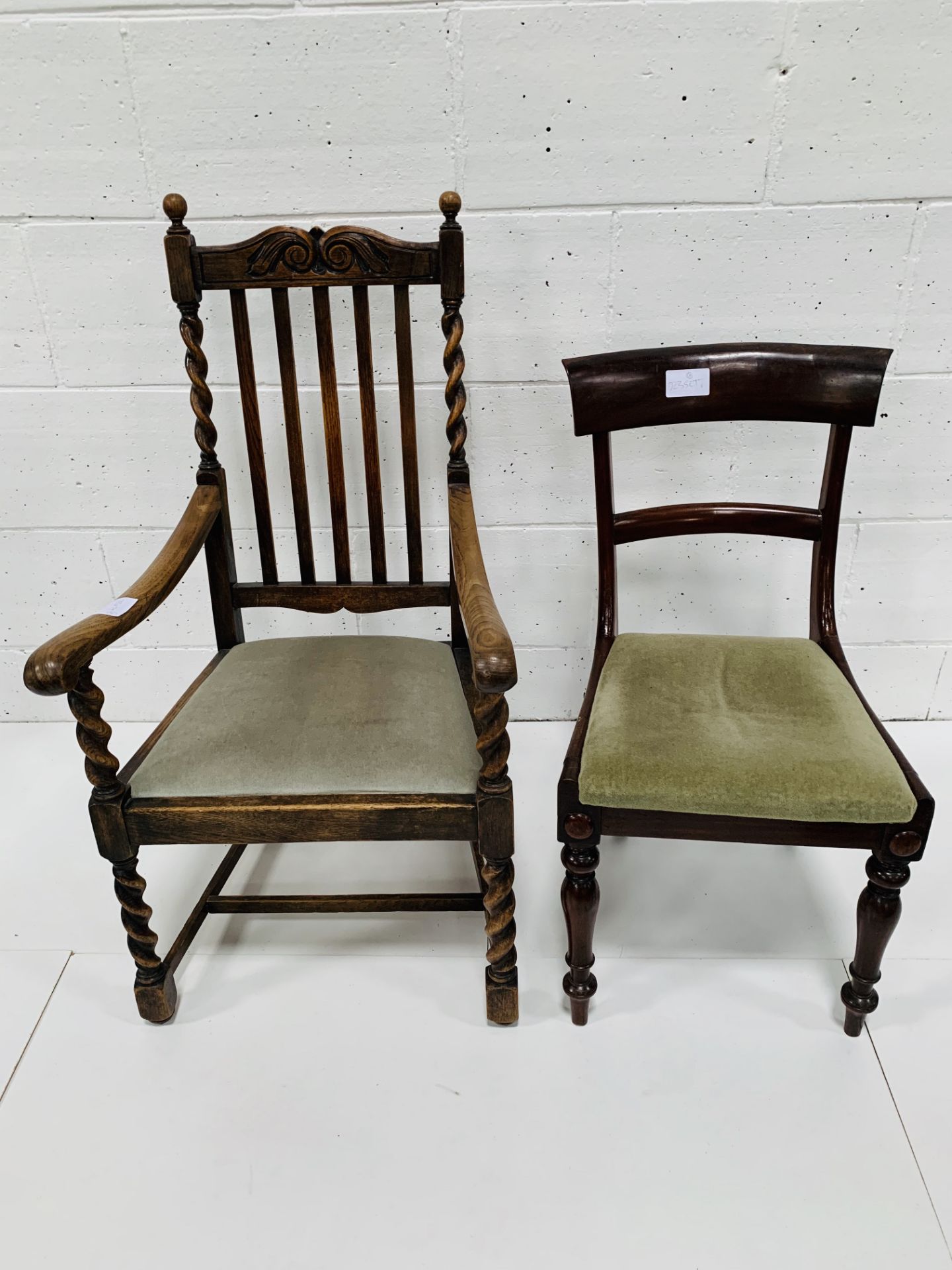 Oak framed open armchair together with a dining chair.