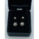 Pair of 18ct white and yellow gold diamond cluster earrings, together with another pair of earrings