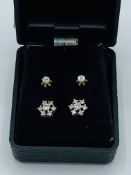 Pair of 18ct white and yellow gold diamond cluster earrings, together with another pair of earrings