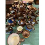 17 items of copper lustre ware.