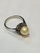 18ct white gold diamond and pearl daisy ring.