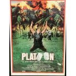 Two framed and glazed film posters, Platoon (1987) and Commando (1985).