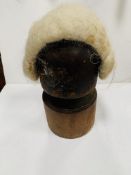 A wooden wig stand and wig.