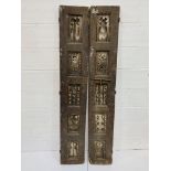 A pair of decorative carved antique wooden shutters, each measuring 33 x 5 x 199cms.