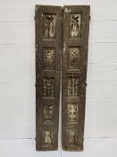 A pair of decorative carved antique wooden shutters, each measuring 33 x 5 x 199cms.