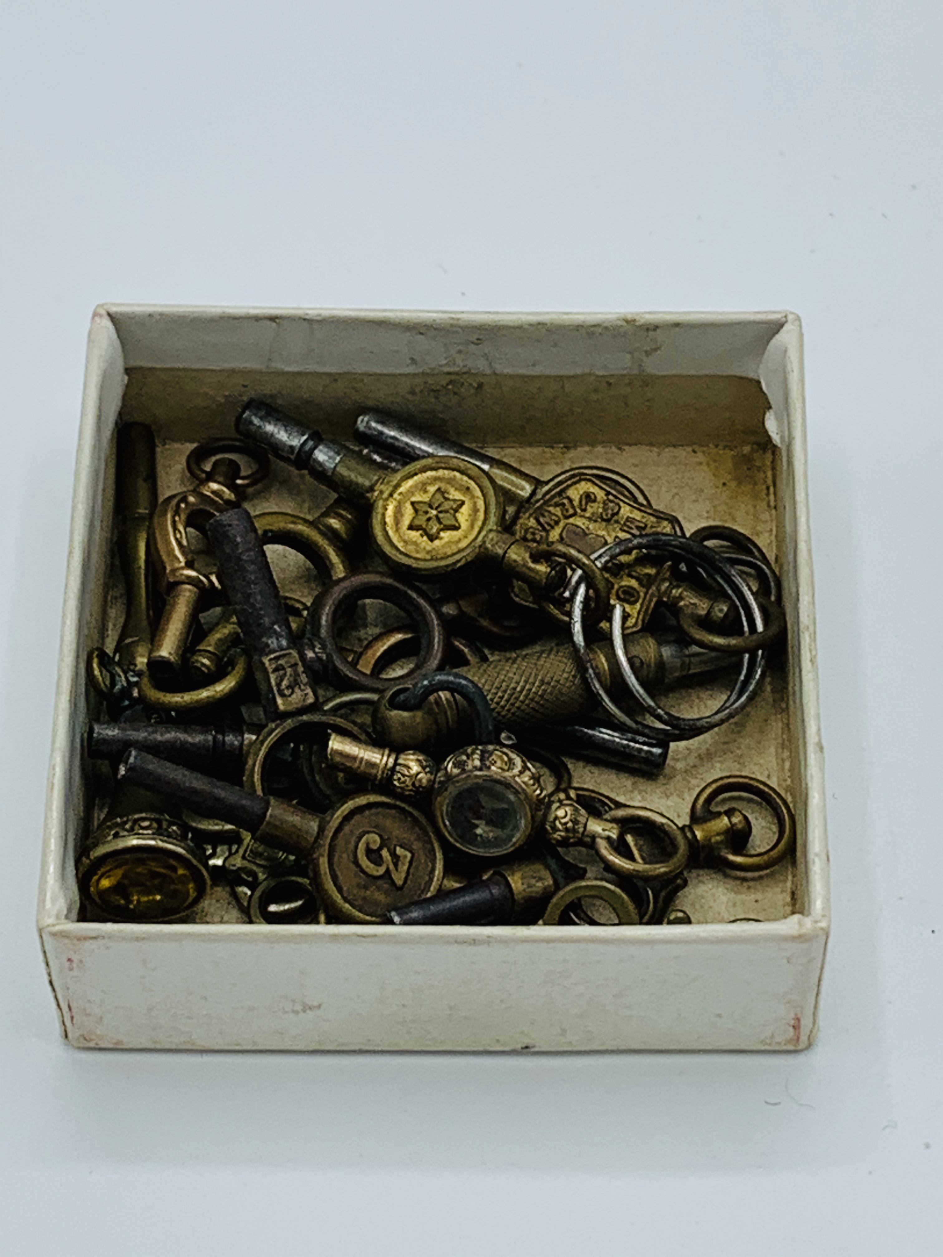 17 antique pocket watch winding keys.