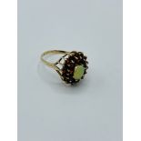 9ct gold, opal and garnet ring.