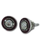 Pair of platinum, ruby and diamond cluster earrings.