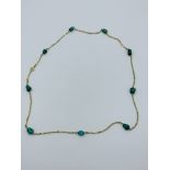 14ct gold and green stone bead necklace.