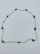 14ct gold and green stone bead necklace.