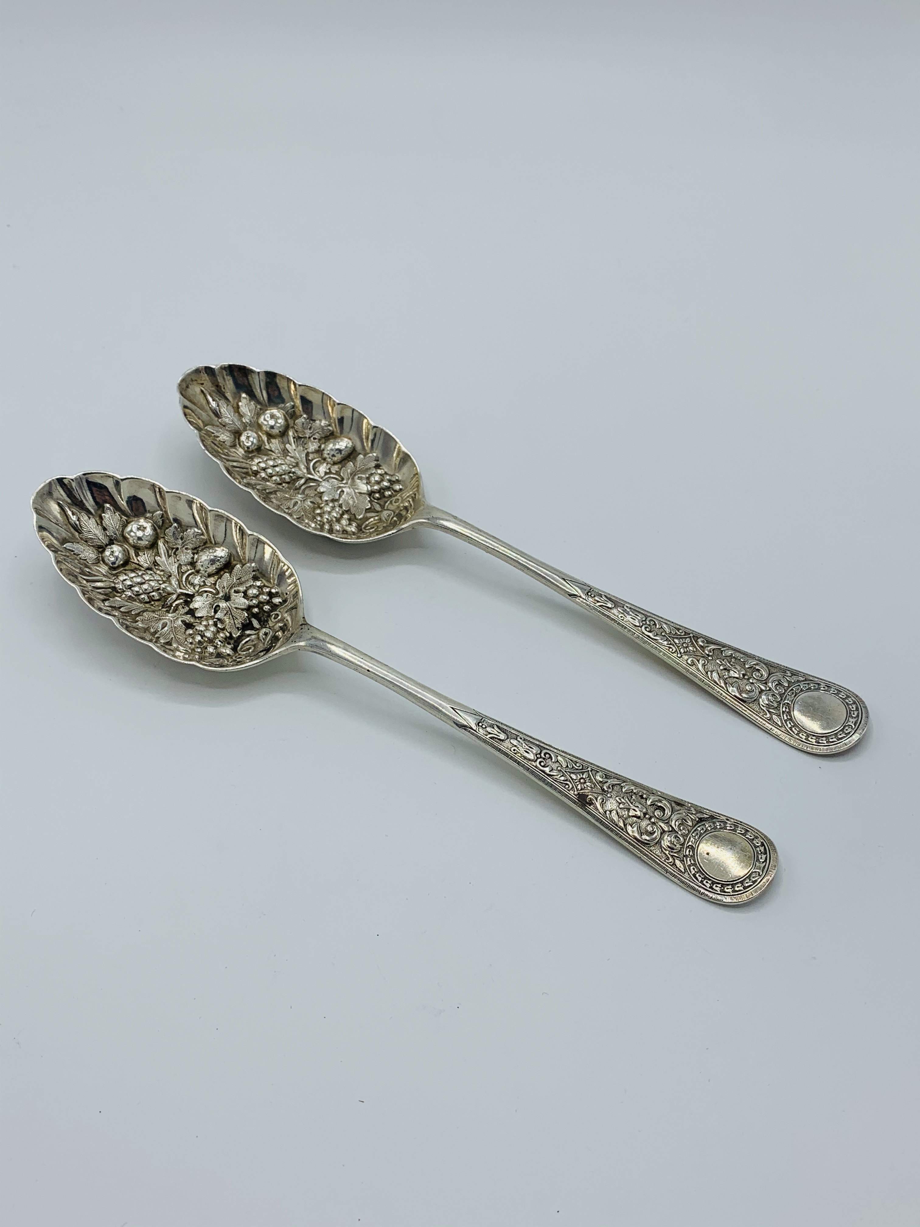 2 silver berry spoons by Walker & Hall.