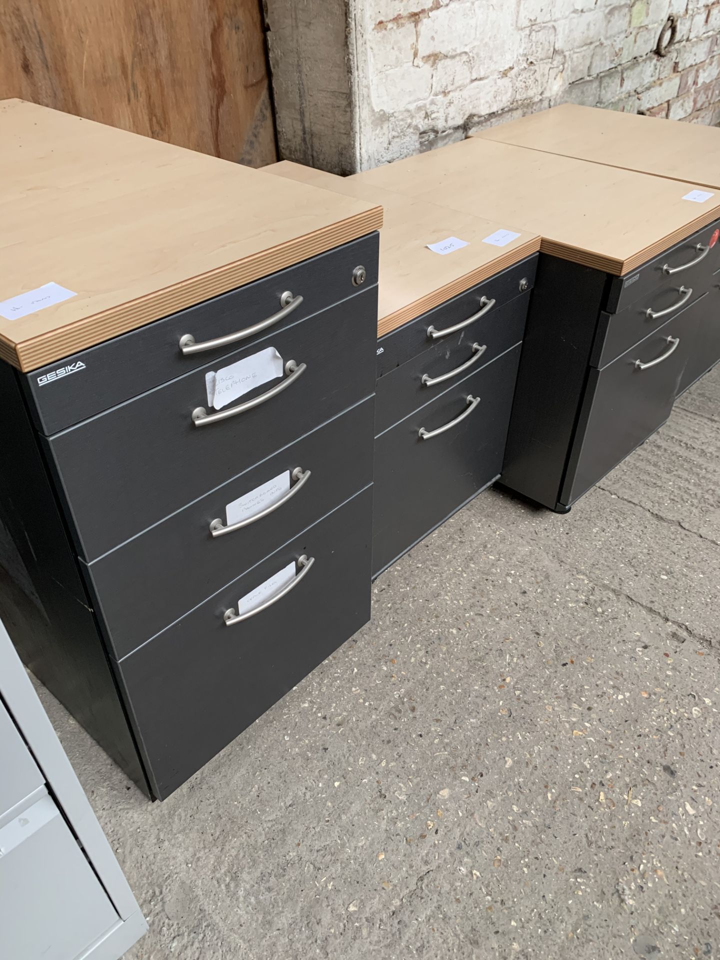 3 Jessika metal pedestal units on casters, together with a Jessika filing cabinet on casters, all ma