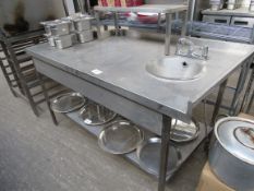 Stainless steel sink with hand sink.