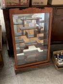 Chinese wall mounted display cabinet with key, together with a collection of ceramic bells.