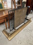 Wrought iron spark guard (length 91cms) together with a brass fender, 133 x 38cms.