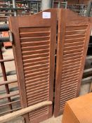 Pair of wooden louvred shutters. Height 125cms.
