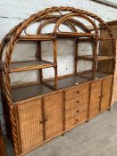 Rattan display unit over 4 drawers flanked by 2 cupboards, 217 x 53 x 196cms.