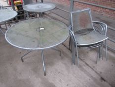 Outdoor metal round table with five chairs.