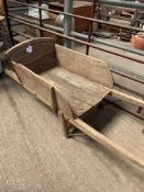 Antique wooden wheelbarrow.