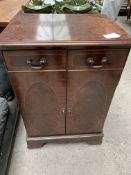 Mahogany hi-fi cabinet with lifting lid, on casters, 57 x 44 x 84cms.