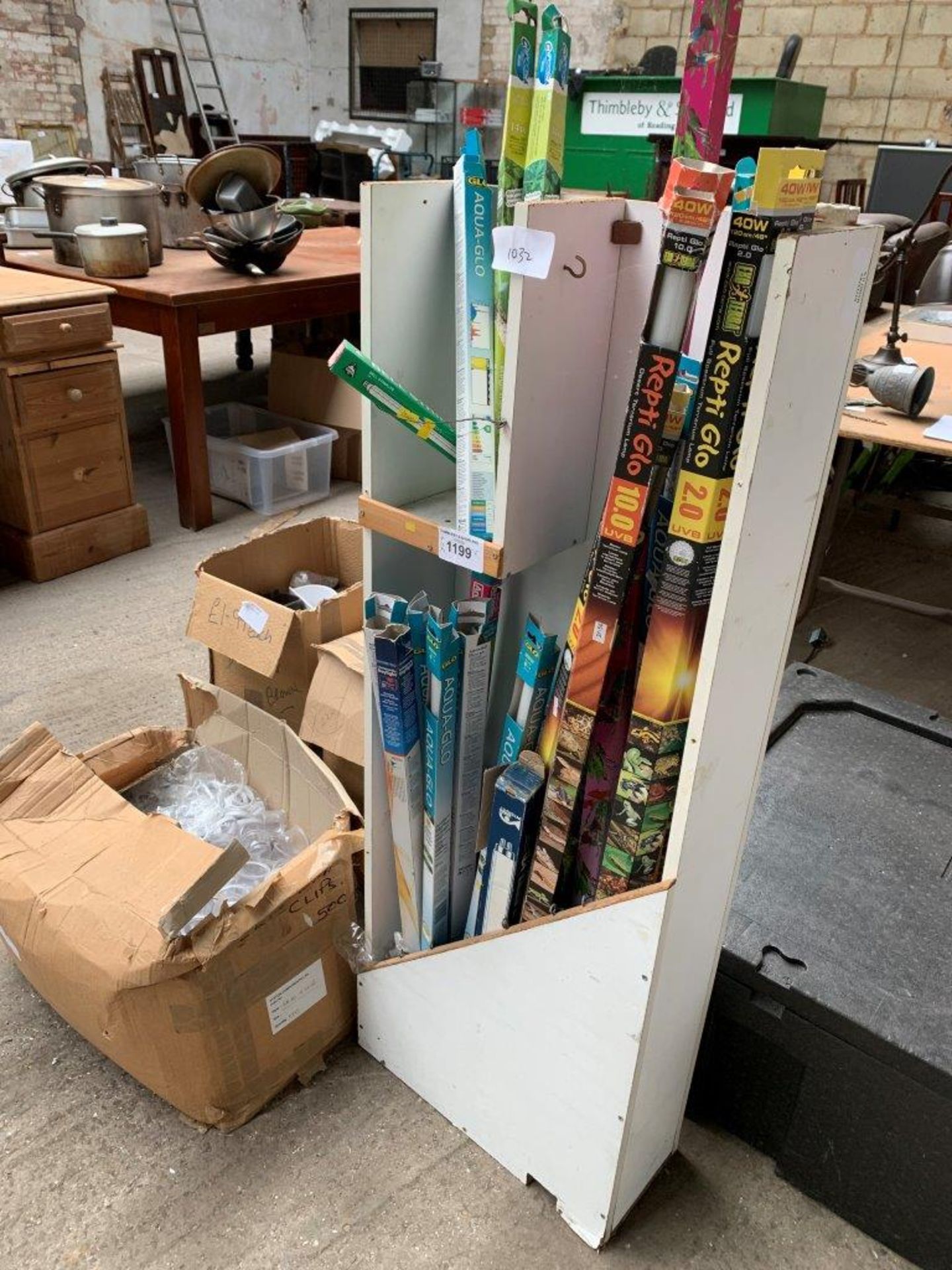 Various boxes of pet accessories and 3 oil filled heaters.