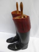 Pair of long black leather hunting boots with mahogany tops and wooden trees, approx.size 10.
