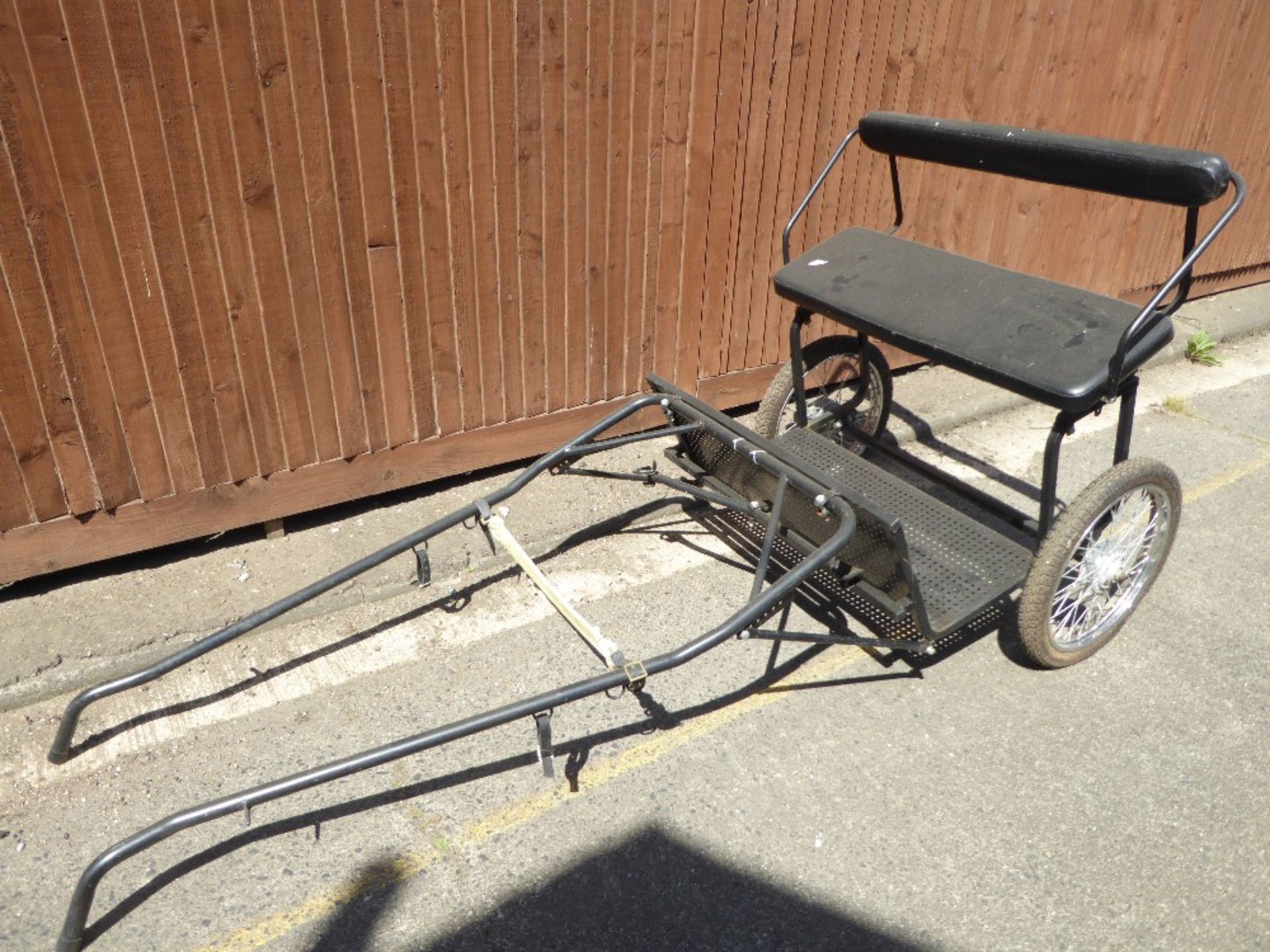 EXERCISE CART to suit 12.2. to 14.2hh. An adjustable vehicle painted black with black upholstery.