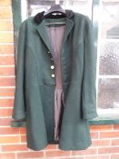 Dark green livery coat with black velvet collar and brass buttons