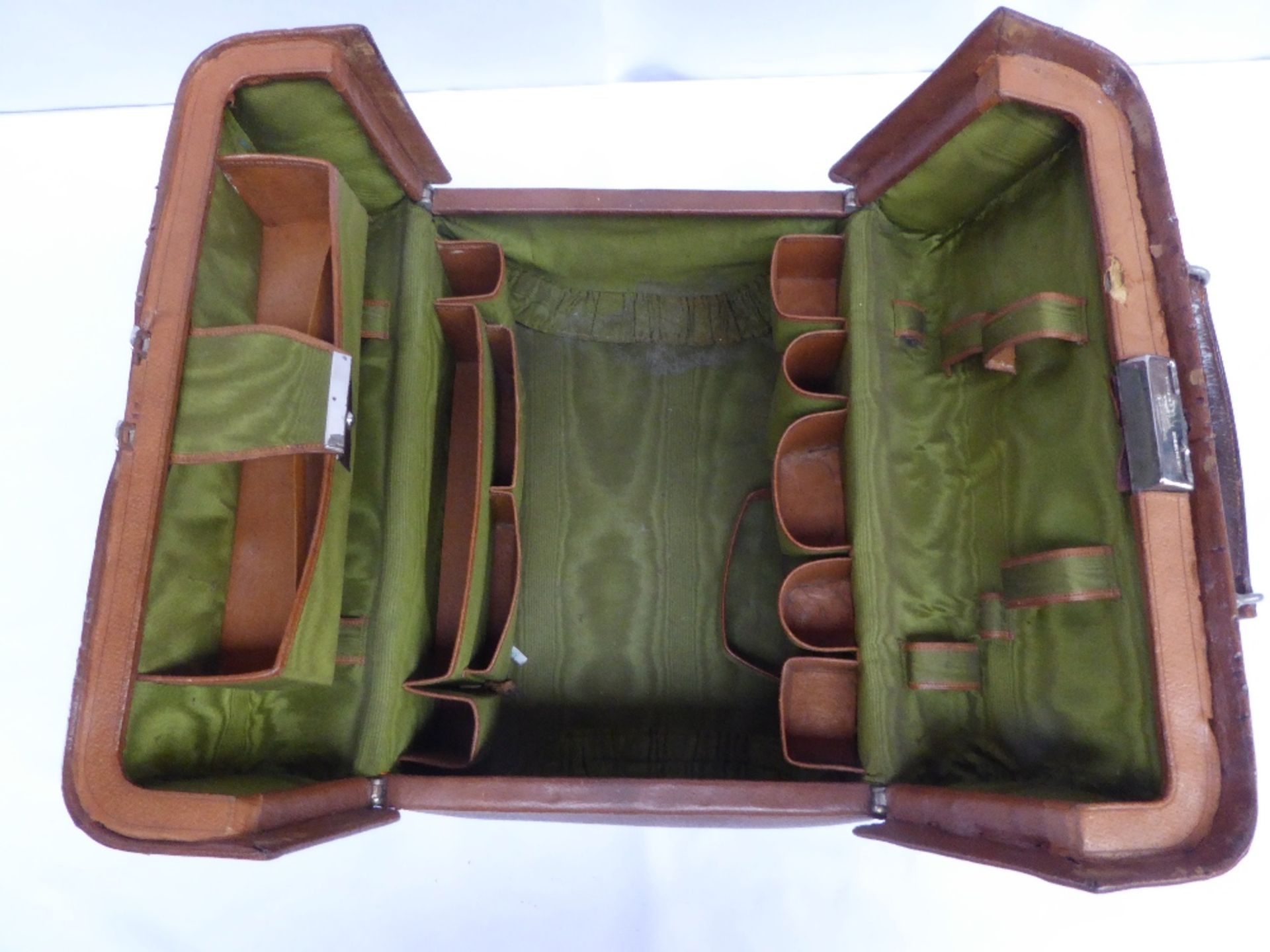 Antique leather travelling case by Greaves of New Street, Birmingham, with green silk-effect lining,